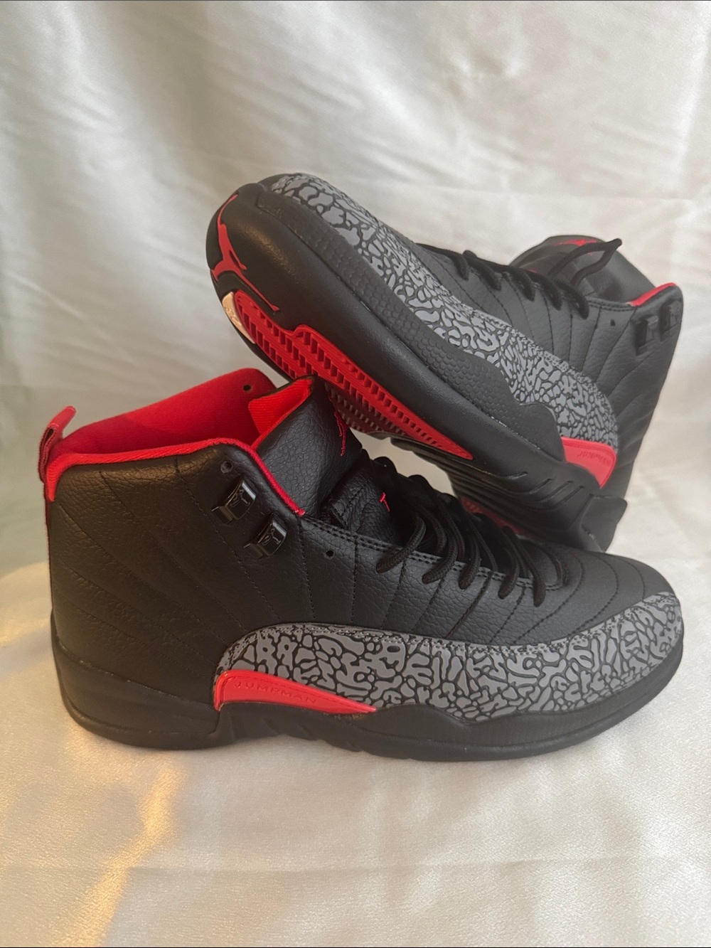 Custom Air Jordan 12 sneakers feature a striking black and red "Bred" colorway!